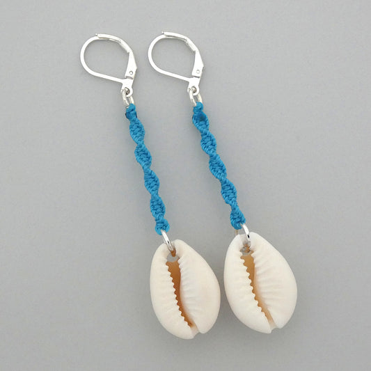 Silver plated leverback earrings with cowrie shells and blue macramé twist detail.