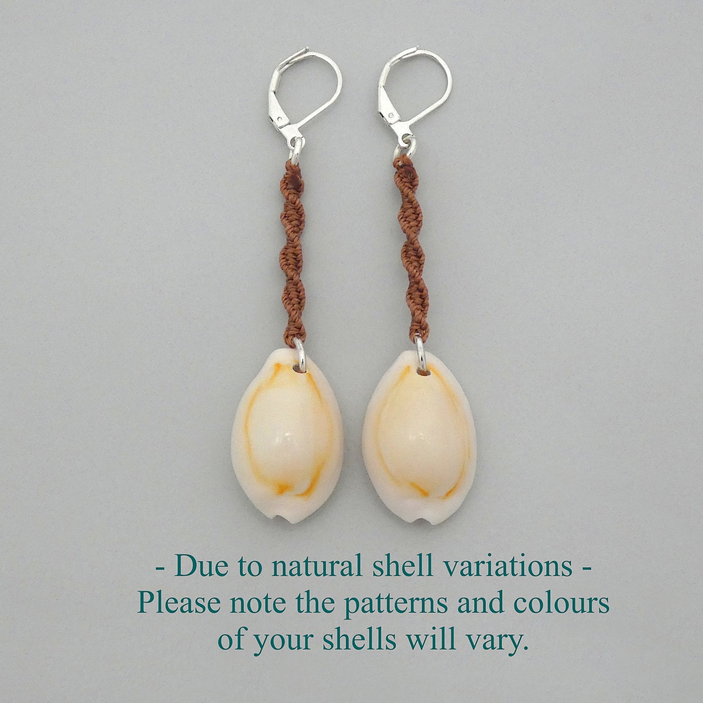 Silver plated leverback earrings with cowrie shells and copper coloured macramé twist detail.