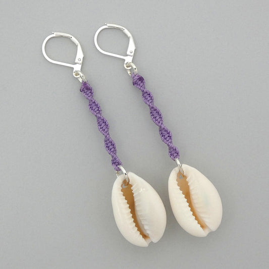 Silver plated leverback earrings with cowrie shells and orchid purple macramé twist detail.