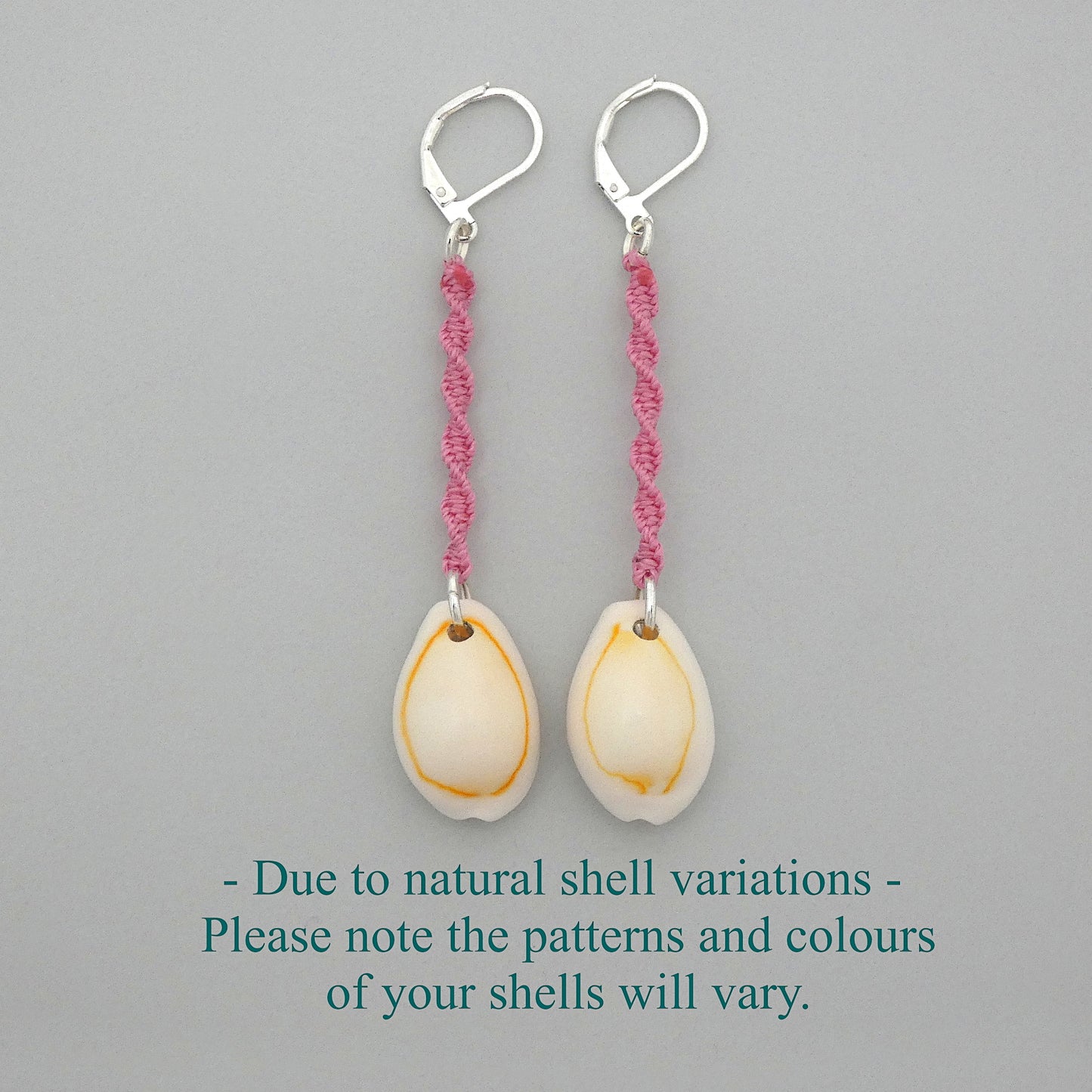 Silver plated leverback earrings with cowrie shells and pink macramé twist detail.