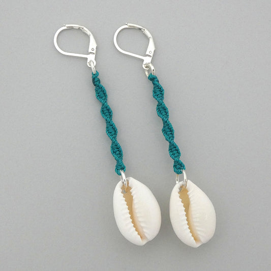 Silver plated leverback earrings with cowrie shells and teal green macramé twist detail.