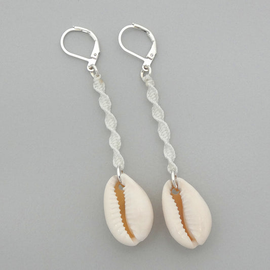 Silver plated leverback earrings with cowrie shells and white macramé twist detail.